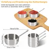 A set of stainless steel sauce pans with different contents on a wooden board, with dimension labels below. Produktbild-Vorschau