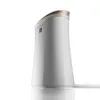 A white Sharp air purifier with a gold-accented top, shown from a side angle against a white background. Podgląd zdjęcia produktu
