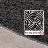 A close-up view of the anti-slip bottom of a rug, showing the textured pattern and a label indicating 'Anti Slip Bottom'. Produktbild-Vorschau