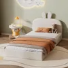 A child's bedroom with a bed, nightstand, and wall decor. Produktbild-Vorschau