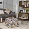 A living room scene with a sofa, ottoman, bookshelf, and floor lamp. Produktbild-Vorschau