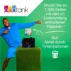 A man in athletic wear points to a display of ink cartridges and bottles, with promotional text about printing capacity and waste reduction. Náhľad obrázku produktu