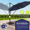 An outdoor patio scene with a navy blue cantilever umbrella shown in use, demonstrating its 360-degree rotation feature. Náhled obrázku produktu