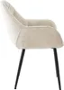 A side view of a cream-colored velvet armchair with black metal legs, isolated on a white background. Produktbild-Vorschau