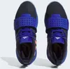 A top-down view of a pair of black and blue Adidas athletic shoes with pink accents. Podgląd zdjęcia produktu