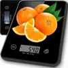 A digital kitchen scale with oranges on it. Produktbild-Vorschau