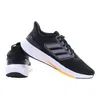 A pair of black Adidas Ultraboost running shoes shown from a side-diagonal angle against a white background. Náhled obrázku produktu
