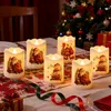 Christmas-themed LED candles with Santa Claus and snowman designs are arranged on a table with a Christmas tree in the background. Produktbild-Vorschau