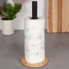 A paper towel holder with a roll of paper towels on a kitchen counter. Náhled obrázku produktu