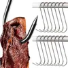 A close-up of a meat hook piercing a piece of meat, with a row of S-hooks in the background. Produktbild-Vorschau