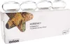 A product shot of four glass spice jars on top of their packaging. Náhled obrázku produktu