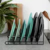 A close-up shot of a black metal dish rack holding several plates. Produktbild-Vorschau