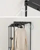 A clothes rack with hanging coats, with a close-up view of how it attaches to the wall. Náhled obrázku produktu