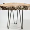 A close-up shot of a table leg set with a natural wood top. Anteprima dell’immagine prodotto