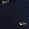 A close-up view of a navy blue Lacoste sweatshirt, showing the brand's signature crocodile logo. Anteprima dell’immagine prodotto