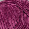 A close-up view of a ball of plush yarn. Podgląd zdjęcia produktu