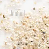 A close-up view of sand grains with a ruler indicating scale. Produktbild-Vorschau