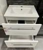 A white bathroom vanity with a sink and two open drawers. Podgląd zdjęcia produktu