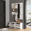 A hallway with a white entryway organizer set, including a shoe cabinet, mirror, and wall-mounted shelves with hooks. Produktbild-Vorschau