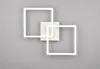 A modern white wall lamp with two overlapping square frames, mounted on a gray wall. Náhľad obrázku produktu
