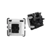 Two mechanical keyboard switches are shown against a white background. One switch is white with a black stem, and the other is black with a white housing. Náhled obrázku produktu