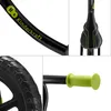 A collage of four close-up images of a black and green balance bike, showing different parts of the bike. Anteprima dell’immagine prodotto