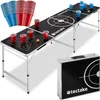 A beer pong table set up with cups and balls, and a folded table in the foreground. Náhled obrázku produktu