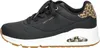 A side view of a black Skechers sneaker with leopard print accents. Voir les images du produit