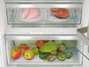 Interior view of an open refrigerator showing food items in drawers. Produktbild-Vorschau
