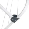 A close-up view of a joint on a white drying rack, showing a gray plastic connector with two silver screws. Podgląd zdjęcia produktu