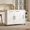 A white kitchen island with a wooden countertop is shown in a kitchen setting. Voir les images du produit
