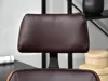 Close-up of the headrest of a brown office chair. Produktbild-Vorschau
