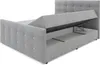 A grey upholstered bed frame with the storage compartment open, revealing the lift mechanism and interior space. Produktbild-Vorschau