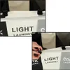 Close-up shots of a laundry basket organizer with multiple compartments. Produktbild-Vorschau
