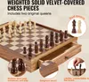 A close-up view of a wooden chess set with pieces arranged on the board, and a drawer pulled out showing storage. Náhled obrázku produktu