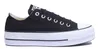 A studio shot of a black Converse platform sneaker. Voir les images du produit