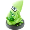 A green squid figurine on a black base against a white background. Produktbild-Vorschau