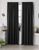 Two black curtains are hanging in front of a window, with a chest of drawers and a small table visible on either side. Produktbild-Vorschau