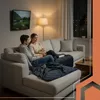A couple is relaxing on a sectional sofa, watching TV and eating popcorn. Náhľad obrázku produktu