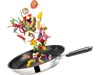 A frying pan with vegetables being tossed into it. Produktbild-Vorschau