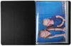 An open binder with a photo of two children inside. Produktbild-Vorschau