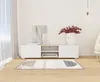 A modern living room setup featuring a TV lowboard with decorative items and a rug. Produktbild-Vorschau