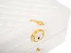 A close-up view of a white jewelry box with gold accents. Podgląd zdjęcia produktu