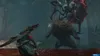 A video game scene depicting a character fighting a monster in a jungle environment. Anteprima dell’immagine prodotto