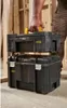 A person is holding two stacked toolboxes. Voir les images du produit