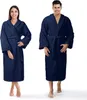 A man and a woman wearing navy blue bathrobes. Produktbild-Vorschau