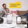 A couple relaxing on a couch with a smart speaker and a voice command bubble. Produktbild-Vorschau