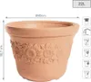 A terracotta flower pot with a sunflower design, shown with dimensions and capacity. Náhľad obrázku produktu