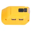 A yellow adapter with two USB ports and two buttons on top. Náhled obrázku produktu