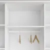 A close-up view of an empty white wardrobe interior with a hanging rail and two wooden hangers. Produktbild-Vorschau